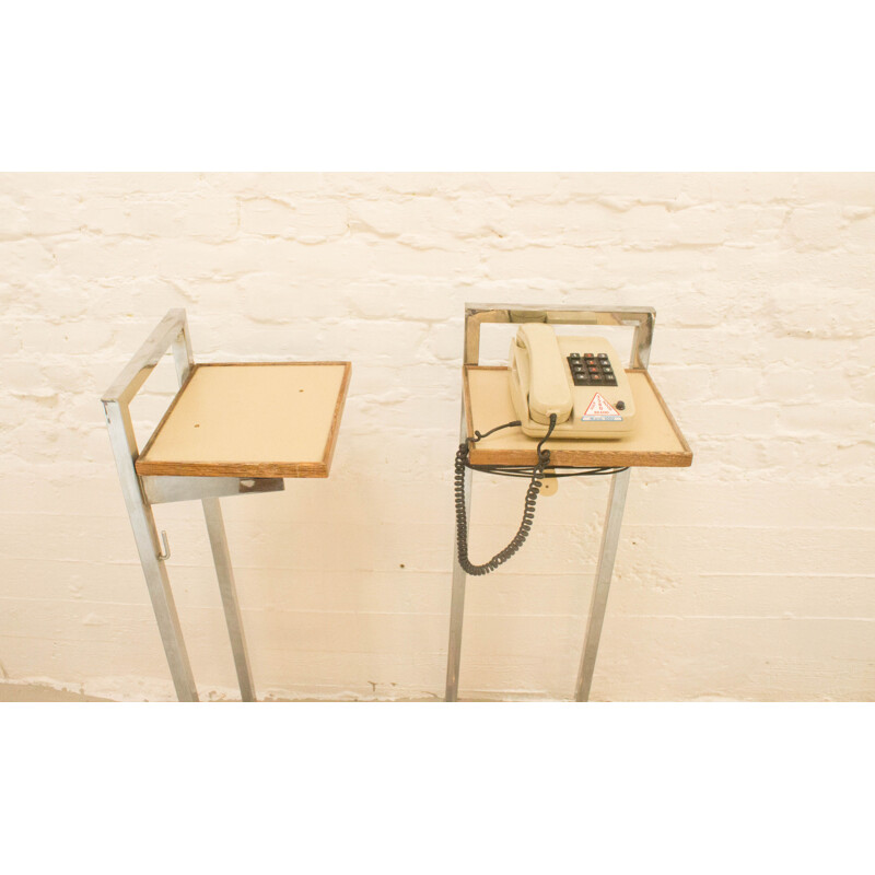 Vintage industrial telephone table on wheels