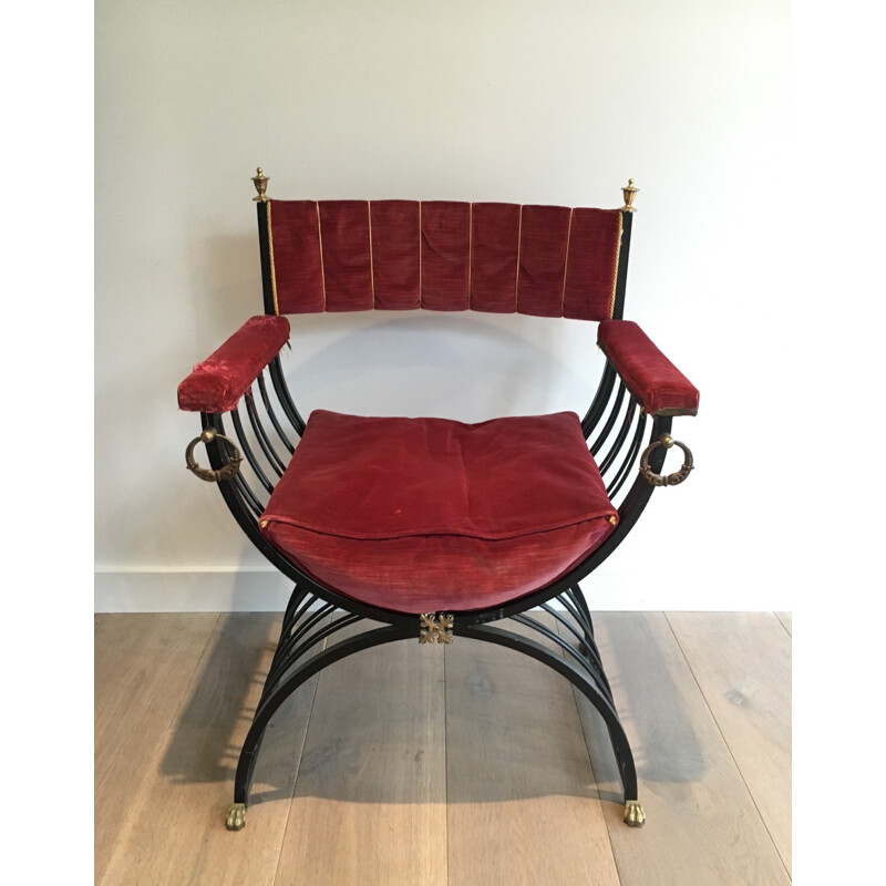 Red curule armchair in black iron and brass - 1970s