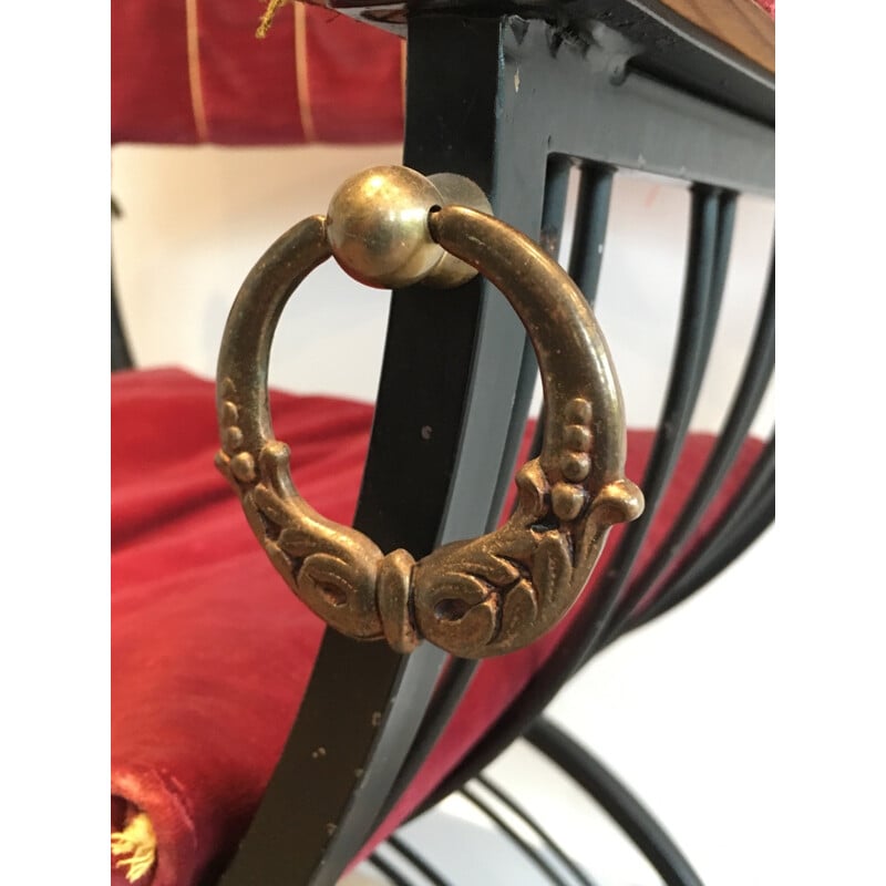 Red curule armchair in black iron and brass - 1970s