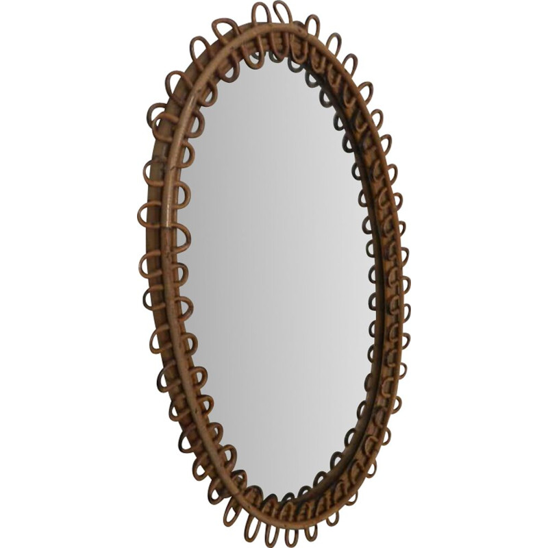 Vintage oval mirror in rattan