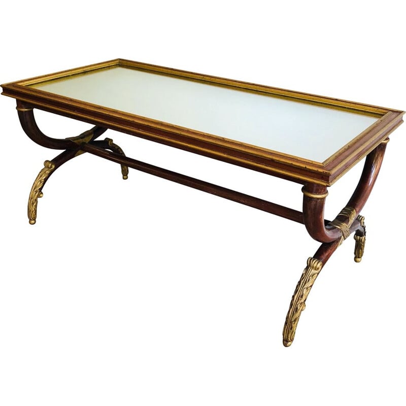 Vintage carved wood and gilt coffee table with mirror top by Maison Hirch, 1940